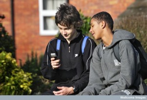 Teenage boys with a mobile phone